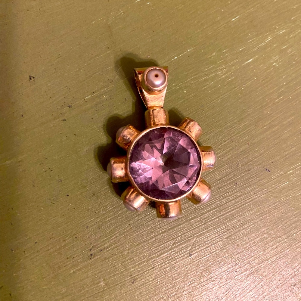 Silver and gold overlay, with centerpiece of amethyst and pearl surrounding